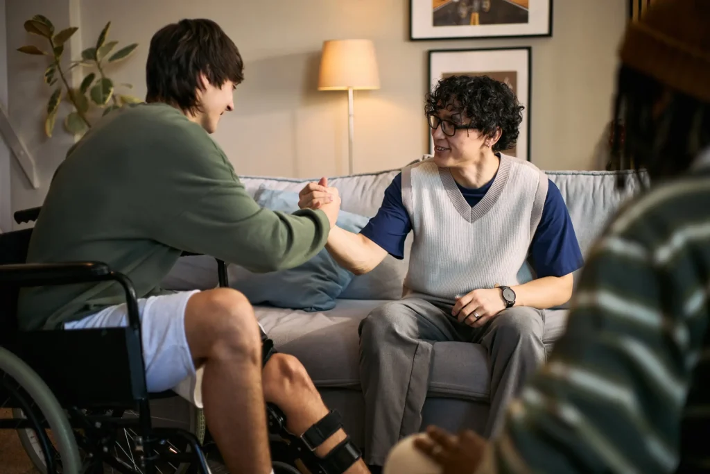 Disabled friends talking at home