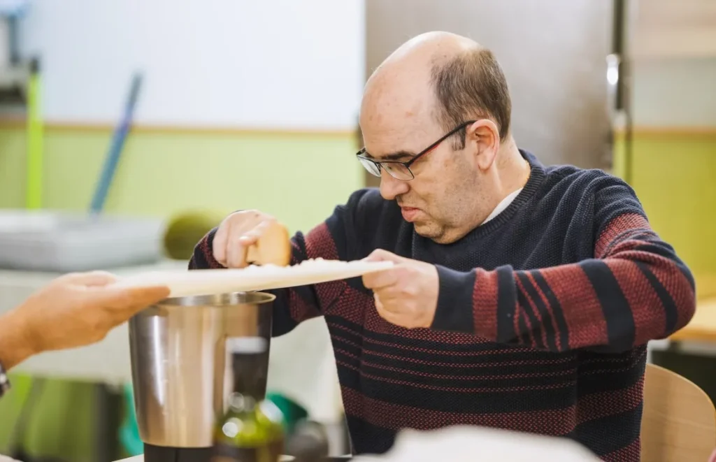 Disabled man in cooking class